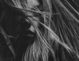 Artistic black and white portrait photography emphasizing mood and expression.